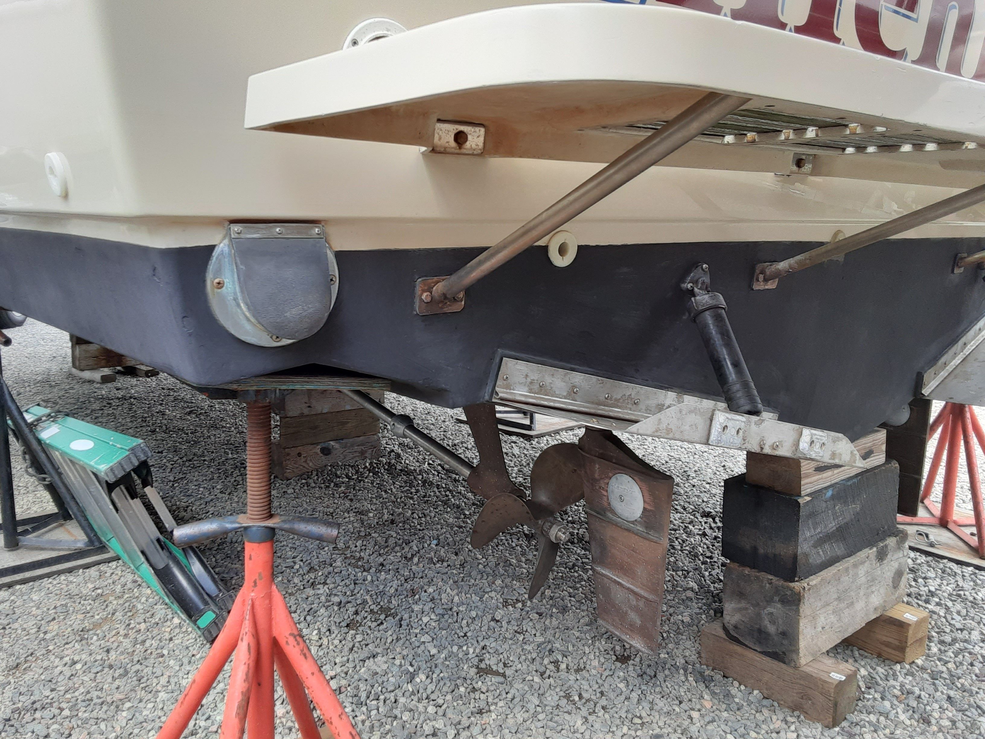 Stern of a 1985 Tiara Yachts 3100 Open on blocks.