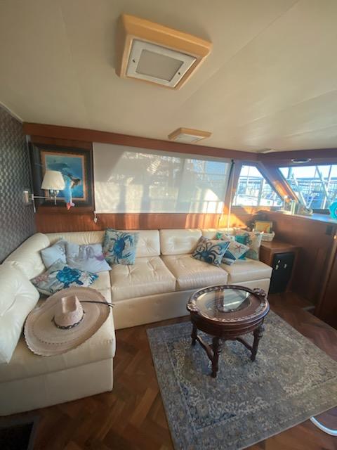 Luxurious interior of 1987 Hatteras 40 Double Cabin with plush seating and elegant decor.