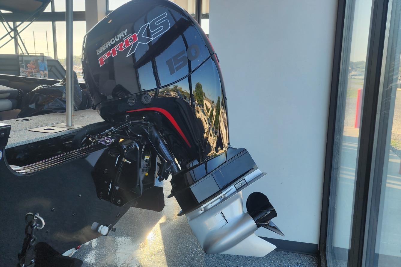Mercury Pro XS outboard motor on a 2023 Lowe boat, displayed indoors.