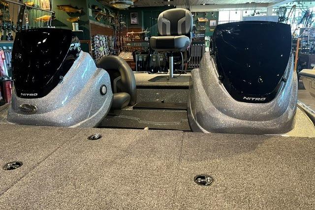 2026 Nitro Z17 boat interior with dual consoles and seating in a showroom.