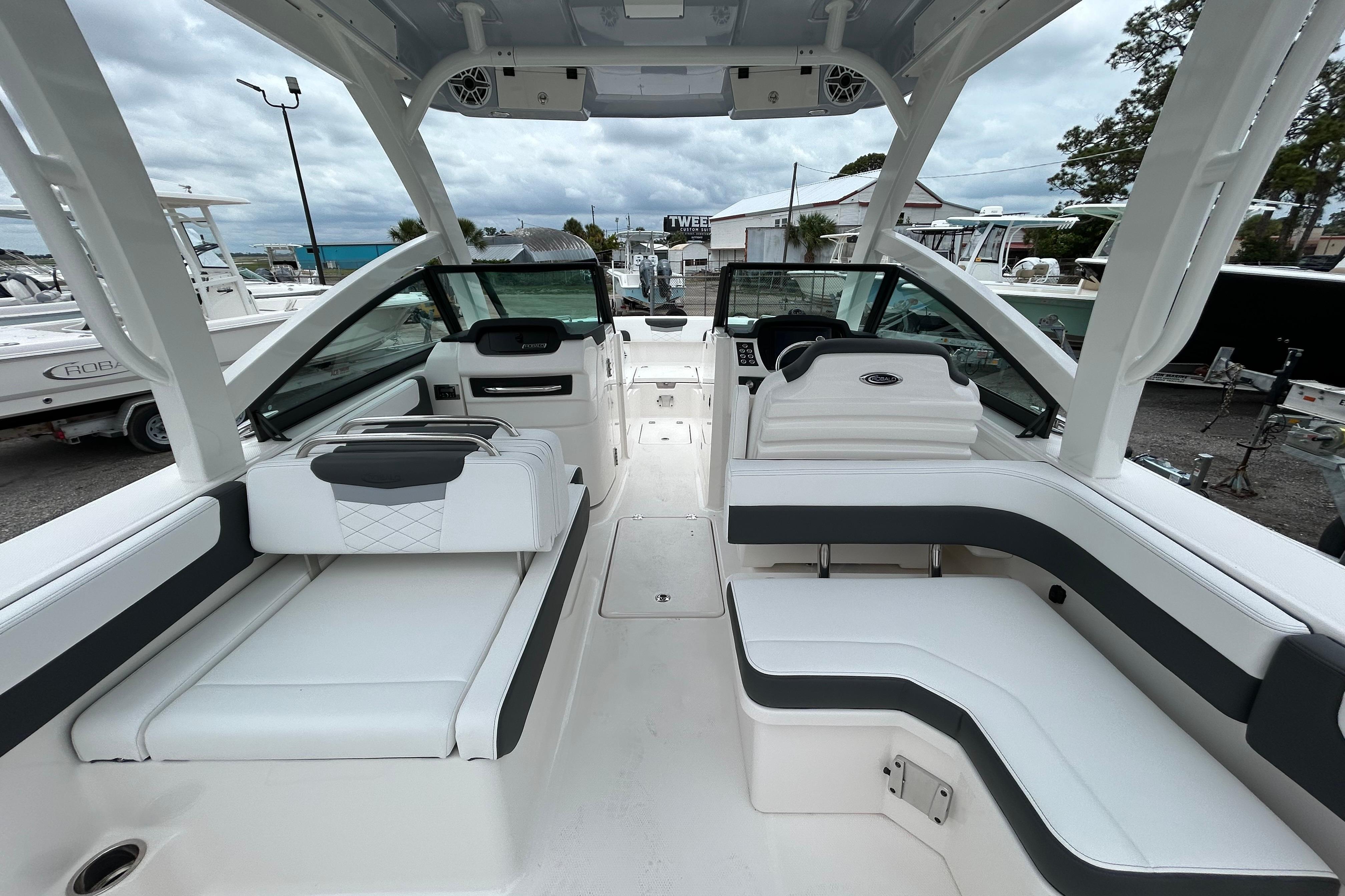 2026 Robalo R277 Dual Console boat interior with white seating and modern design.