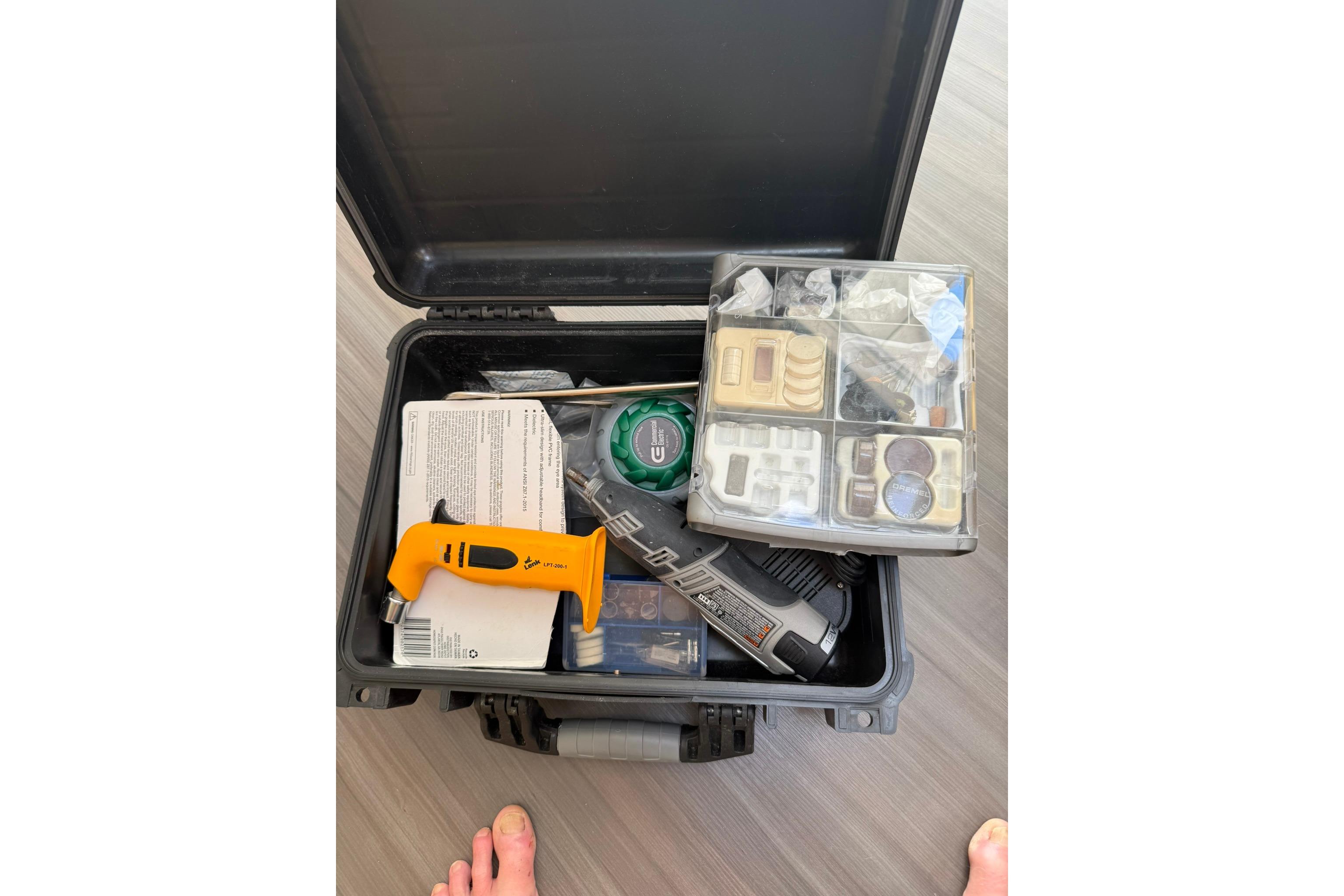 Open toolbox with assorted tools and accessories on a 2020 Outremer 51 yacht.