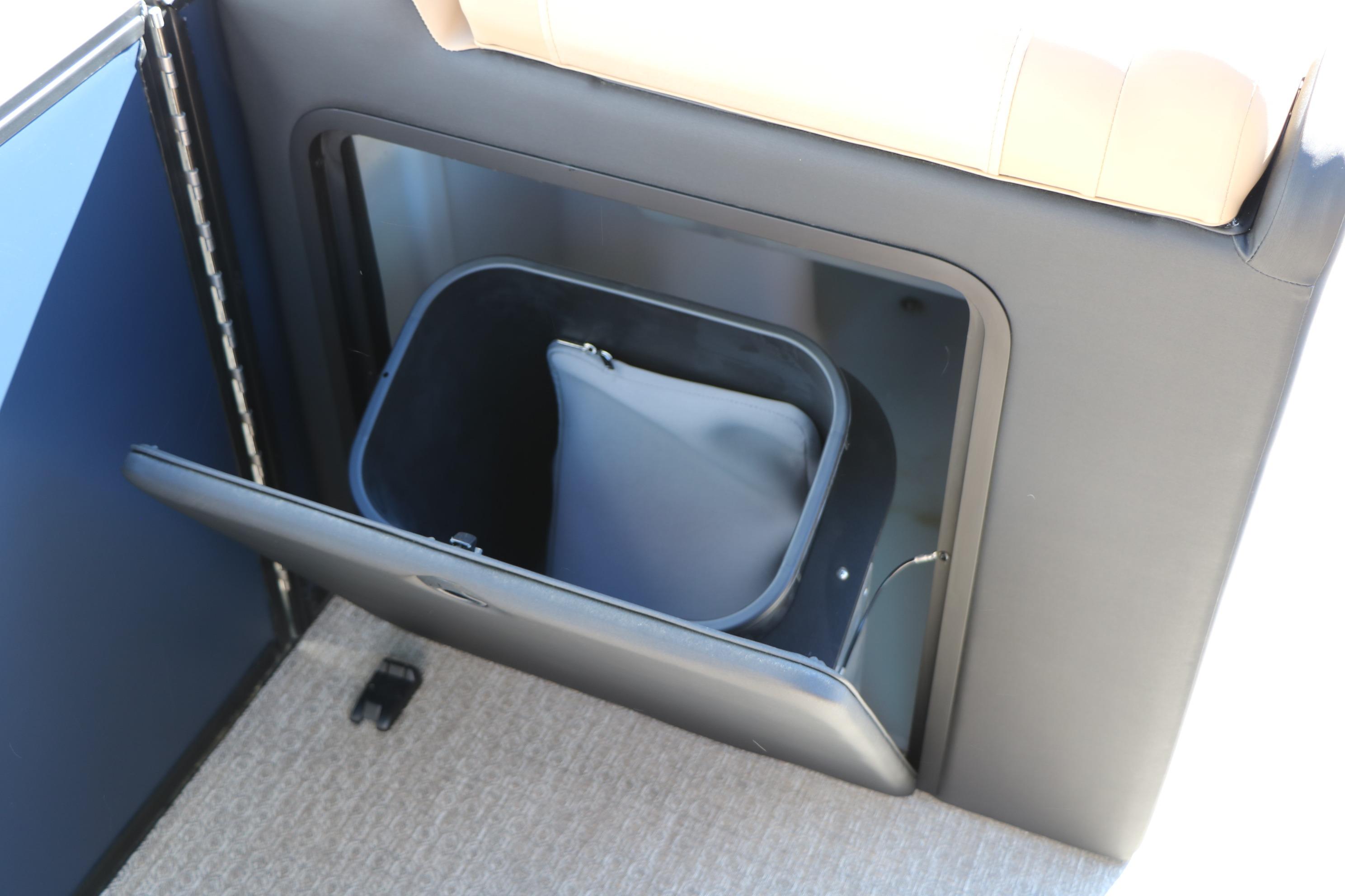 Storage compartment in 2026 Evotti 525 QL Tri-Toon boat interior.