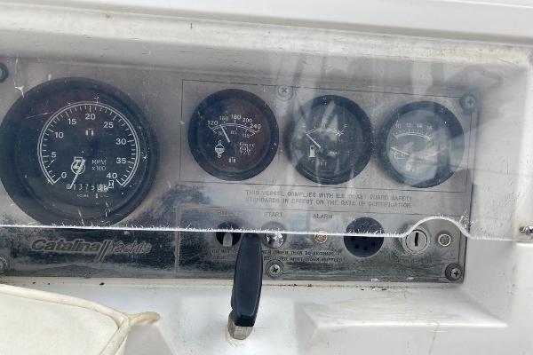 Dashboard of a 1989 Catalina 30 sailboat with various gauges and controls.