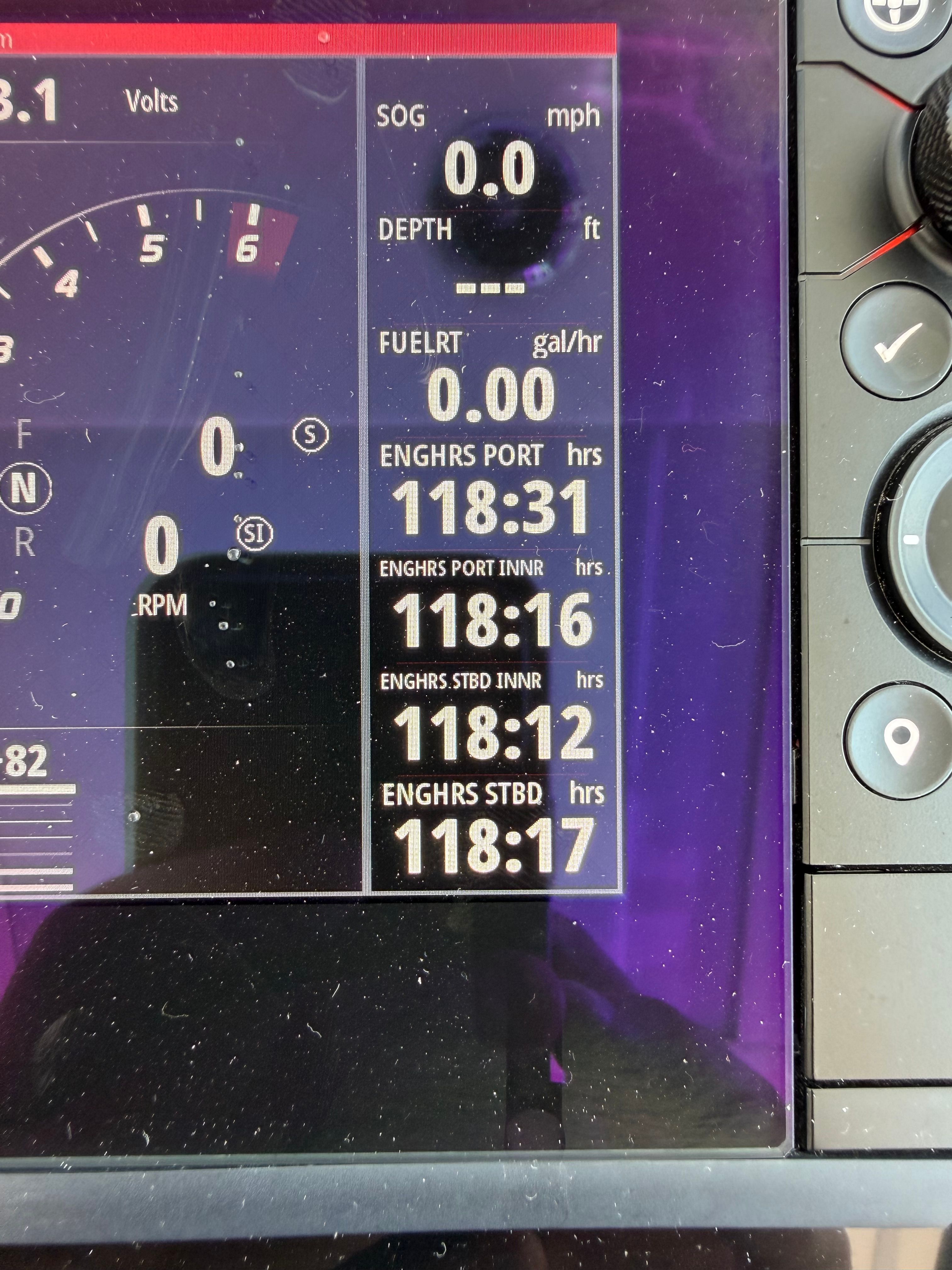 Close-up of a boat display showing engine hours and other metrics.