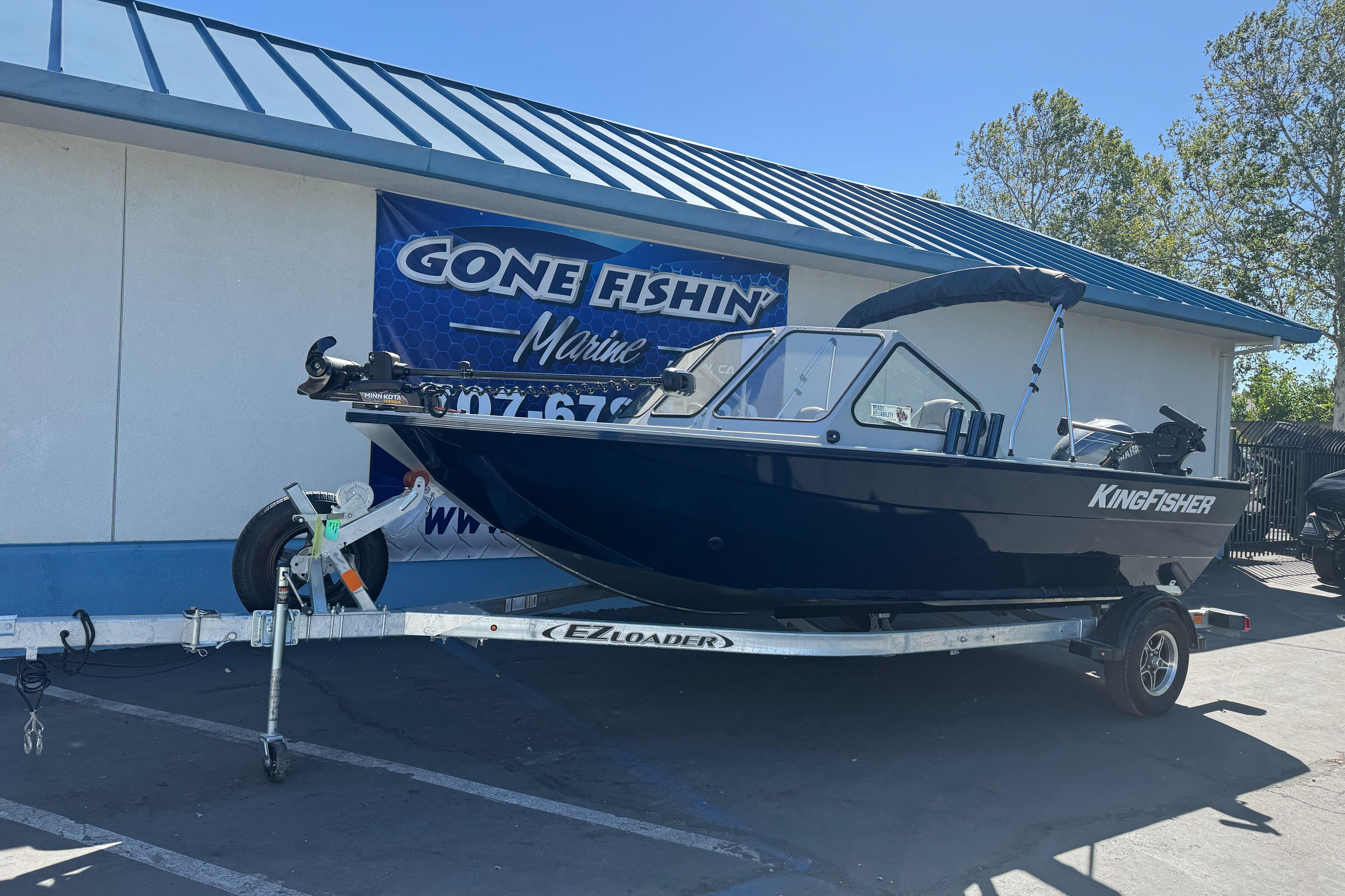 2026 KingFisher 16 Falcon boat on trailer at Gone Fishin' Marine dealership.