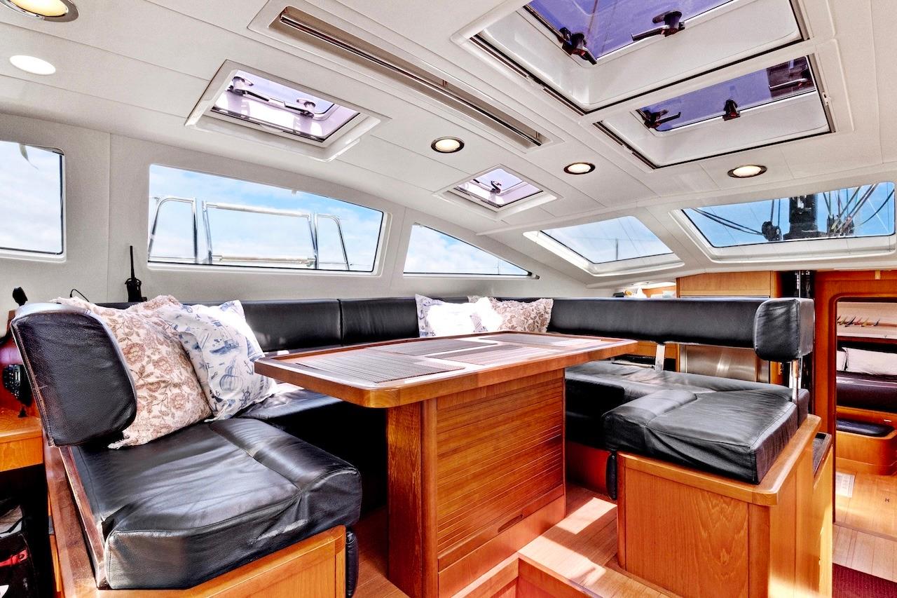 Luxurious interior of 2011 Southerly 57 RS yacht with skylights and plush seating.