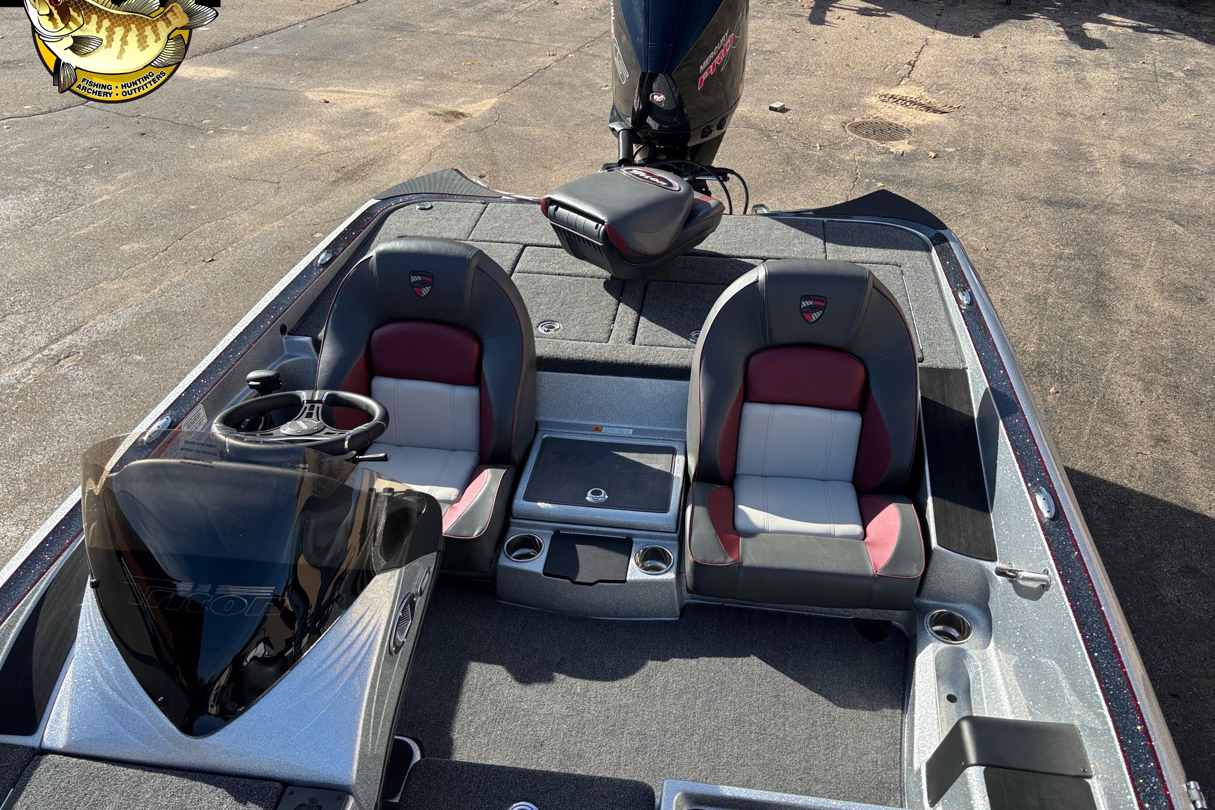2025 Triton 18 TrX boat interior with dual seats and steering console.