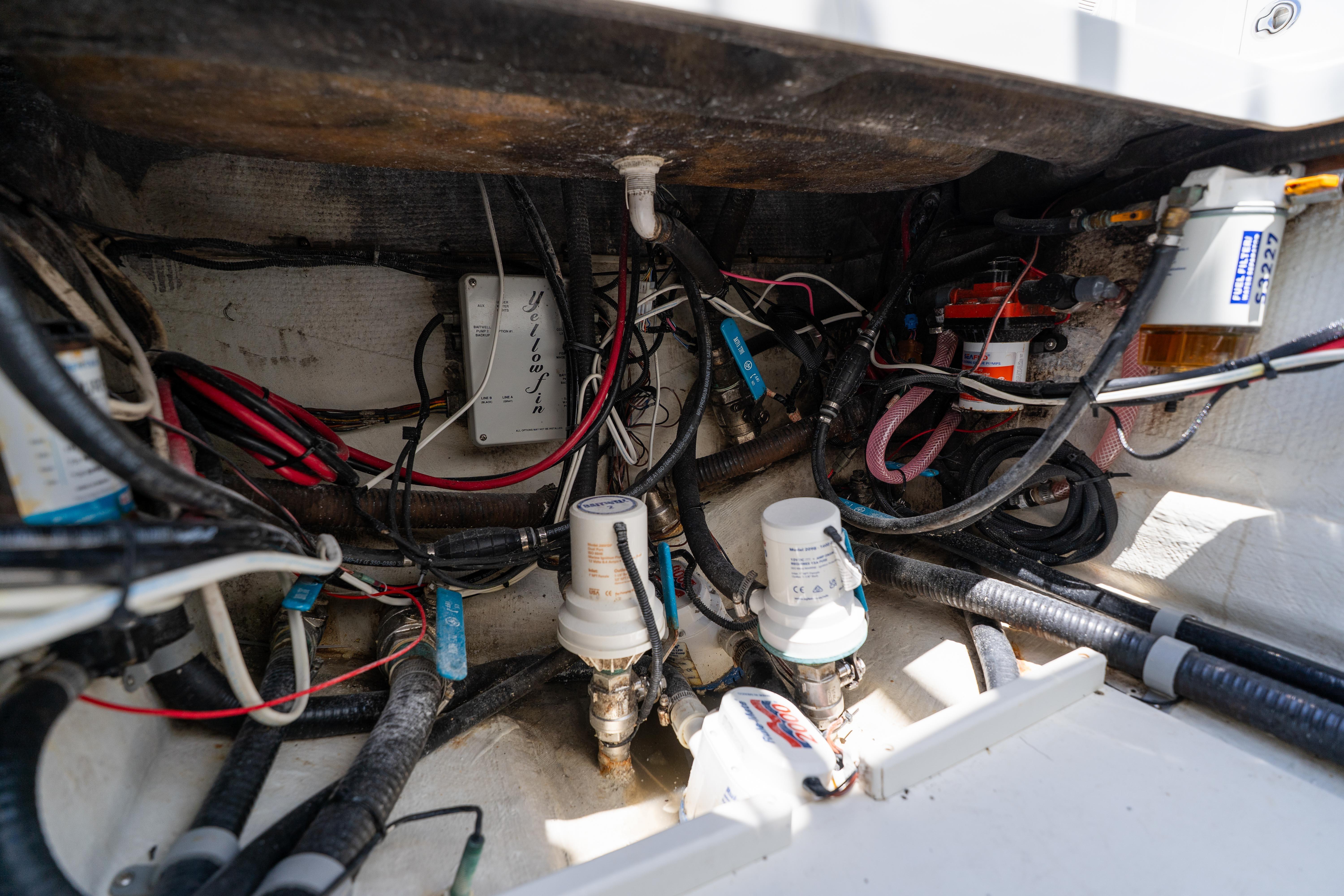 Engine compartment of a 2007 Yellowfin 34 Offshore boat, showcasing wiring and components.
