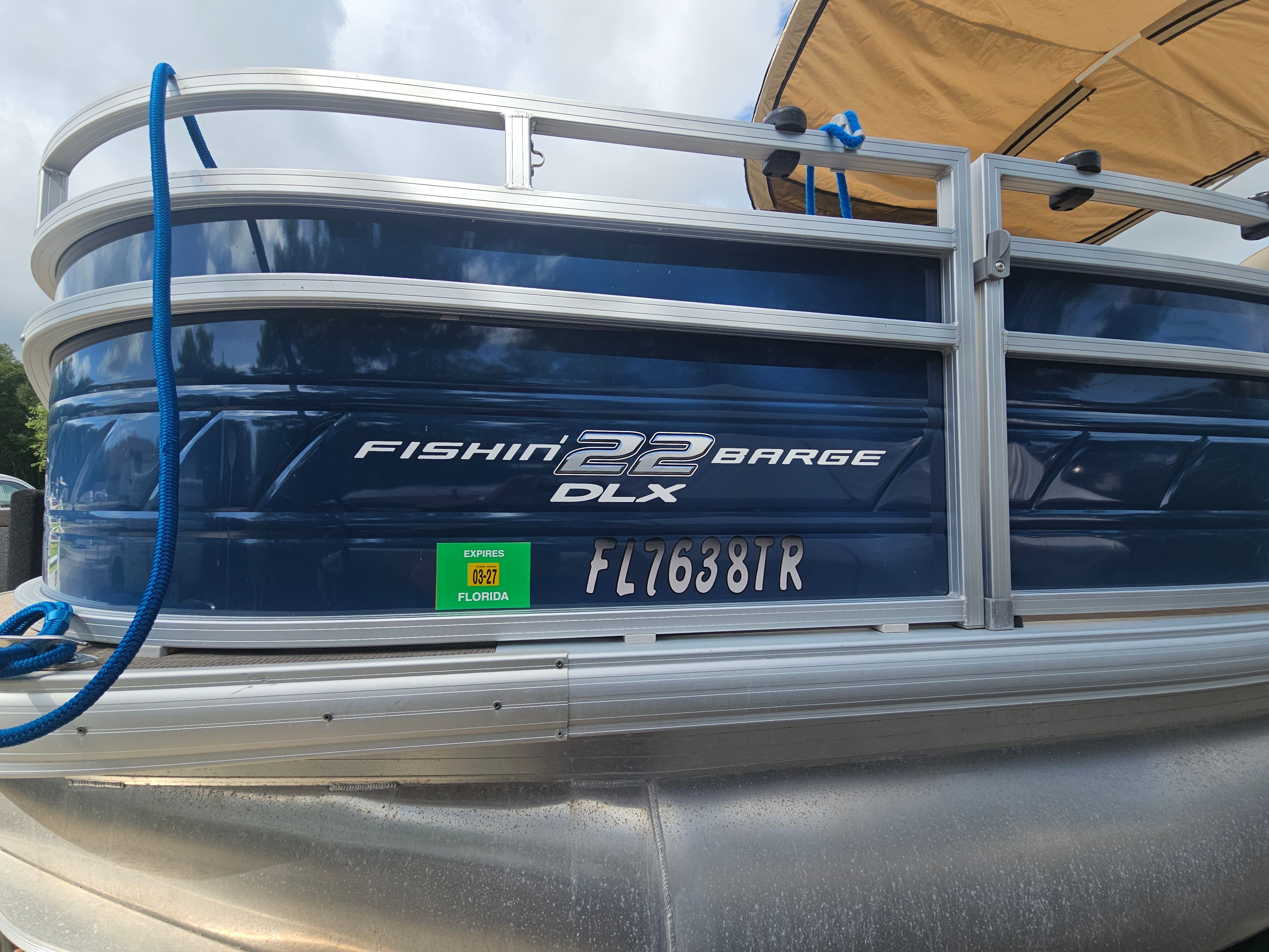 2024 Sun Tracker Fishin' Barge 22 DLX boat with Florida registration.