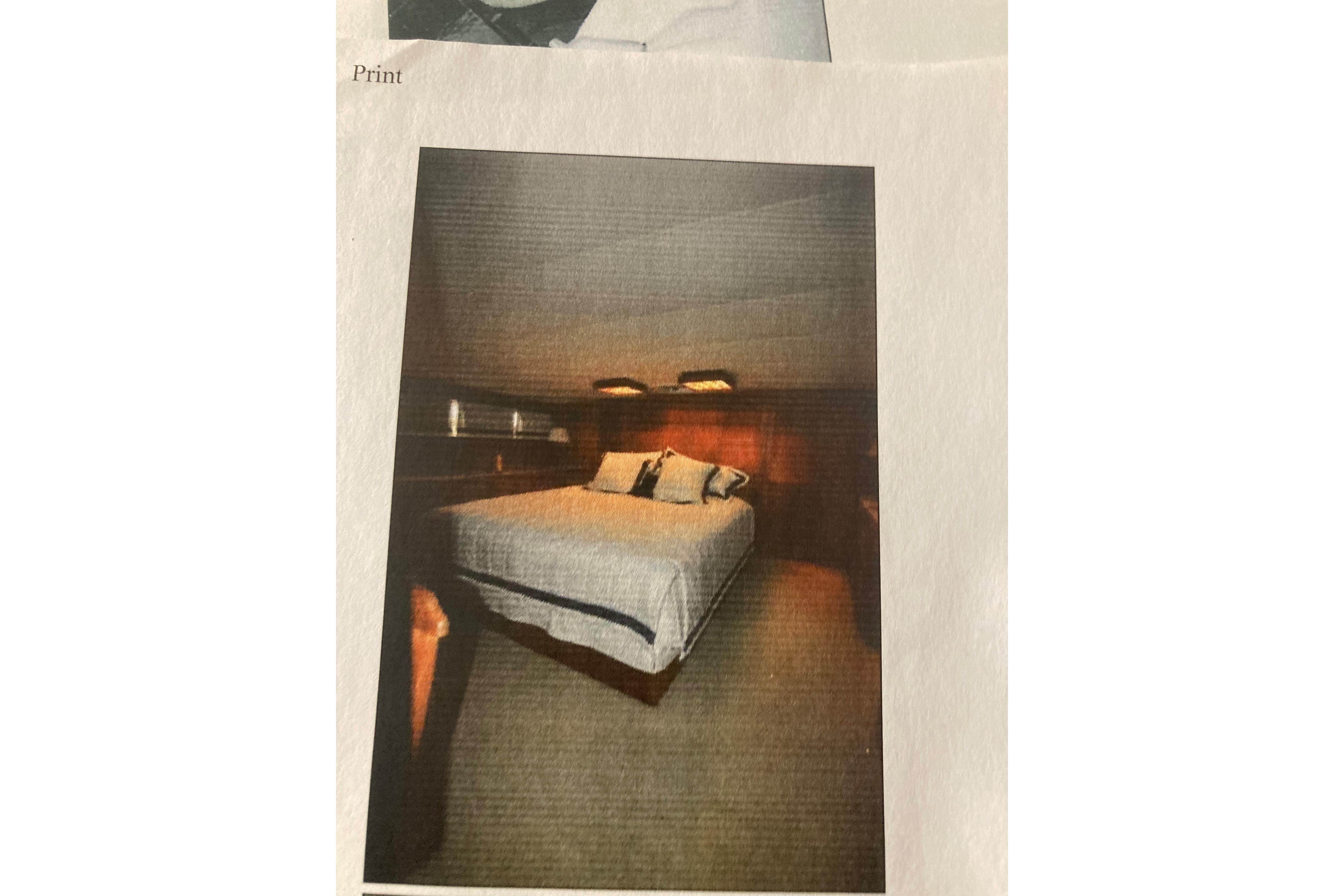 Luxurious bedroom interior of 1985 Bertram 58 Flybridge Motor Yacht, featuring cozy bedding and warm lighting.