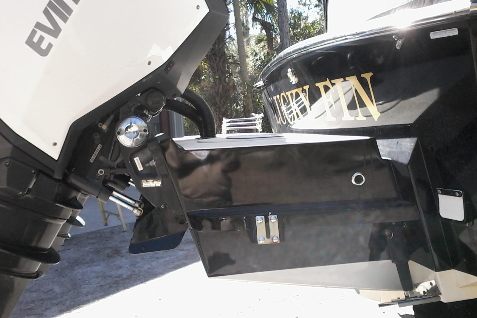 2002 Albemarle 265 Express Fisherman boat with Evinrude engine, named "Lucky Fin."