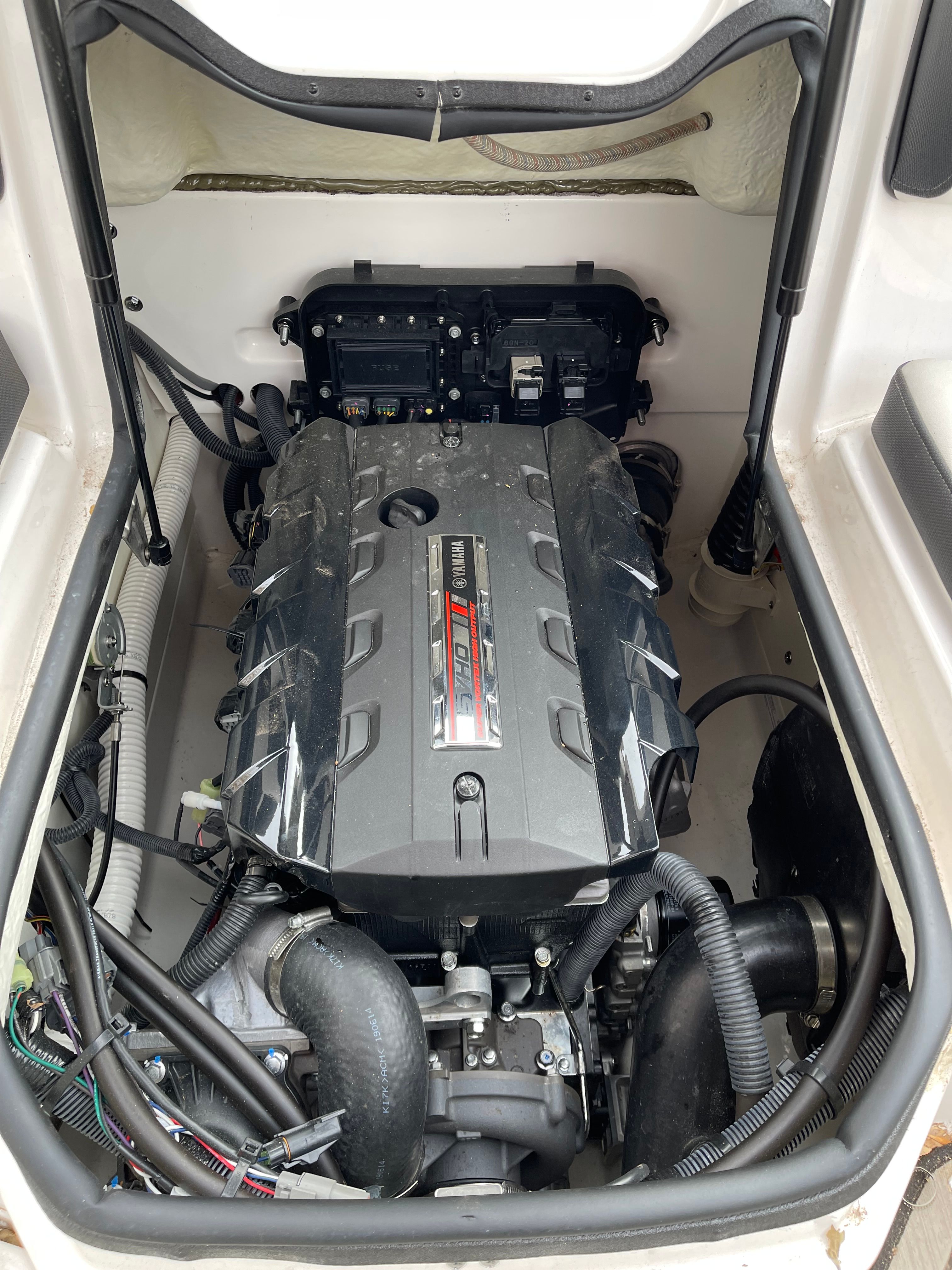 The engine compartment of a 2020 Yamaha 195S boat with a powerful engine.
