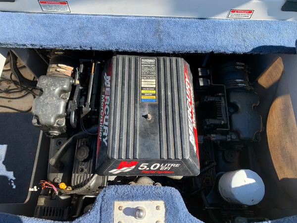 2000 Sea Ray 210 Bow Rider engine compartment with Mercury 5.0L motor.