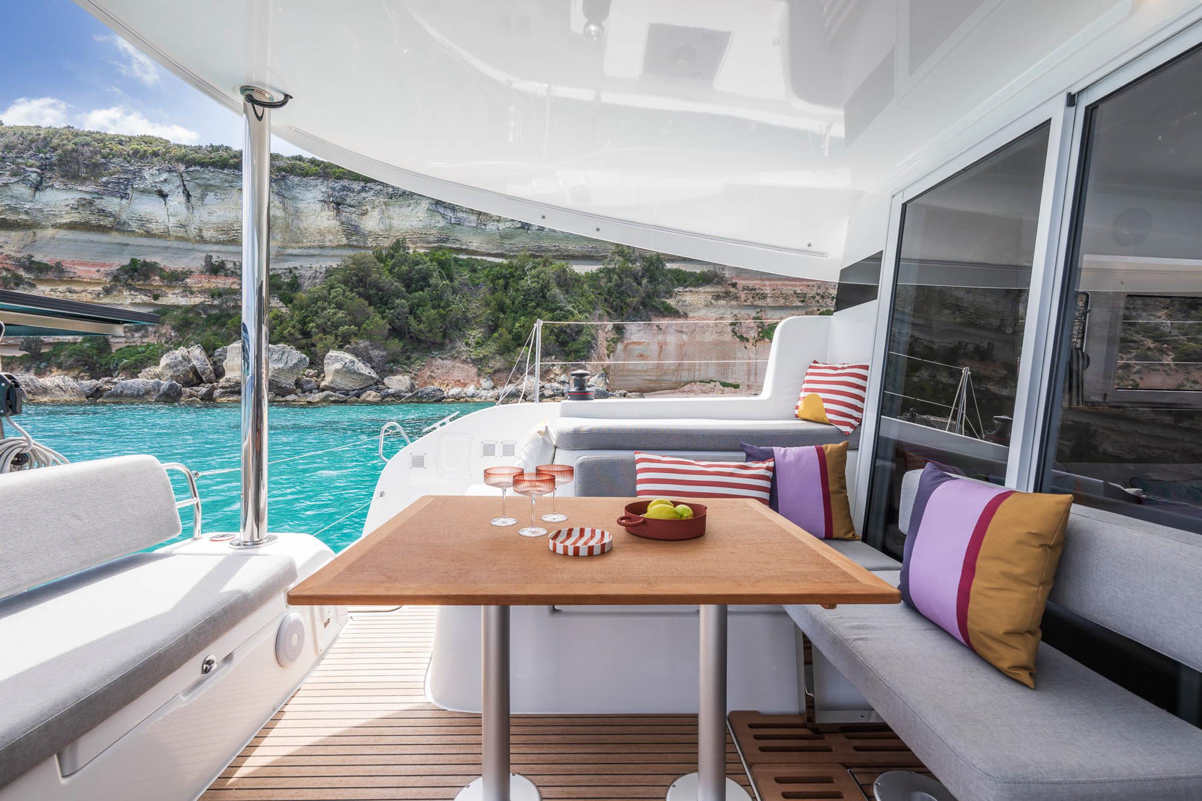 Luxurious Lagoon 38 catamaran interior with scenic ocean view, 2025 model.