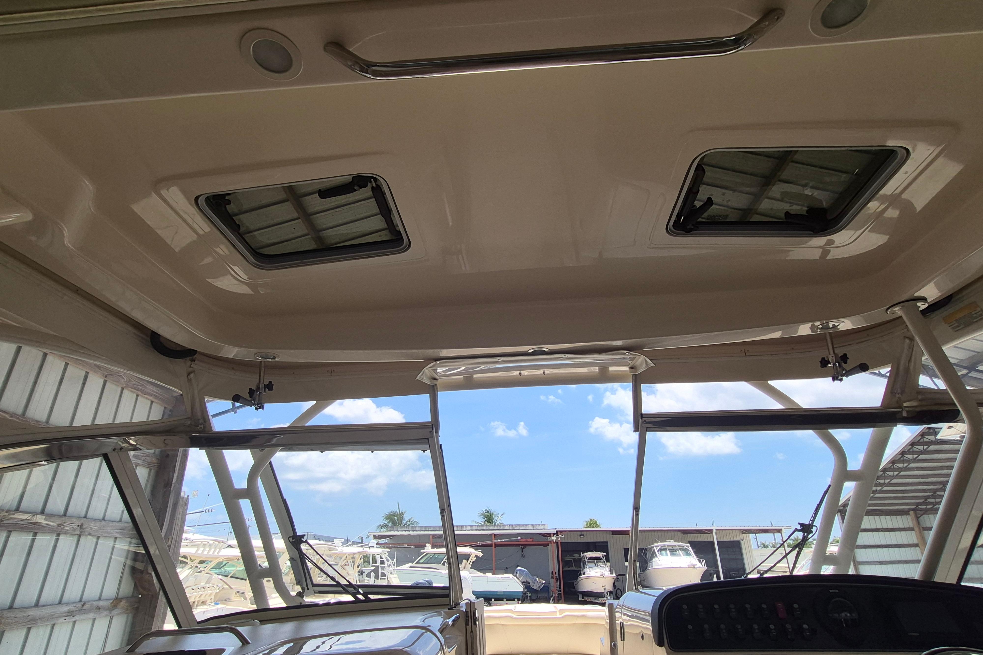 Interior view of 2019 Grady-White Freedom 335 boat, showcasing ceiling hatches and cockpit area.