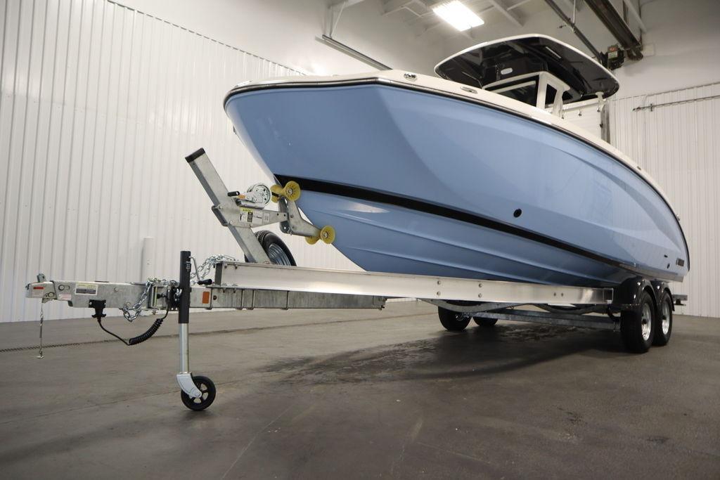 2026 Yamaha Boats 255 FSH Sport E on trailer in indoor setting.