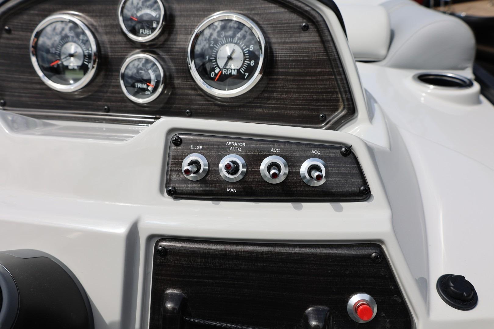 Dashboard of 2026 Lowe SS 210 CL boat with gauges and switches.