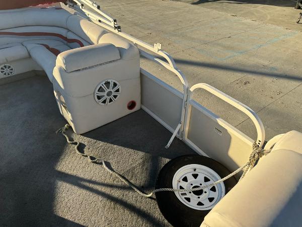 2005 Starcraft 22 Sport boat interior with cushioned seating and spare tire.