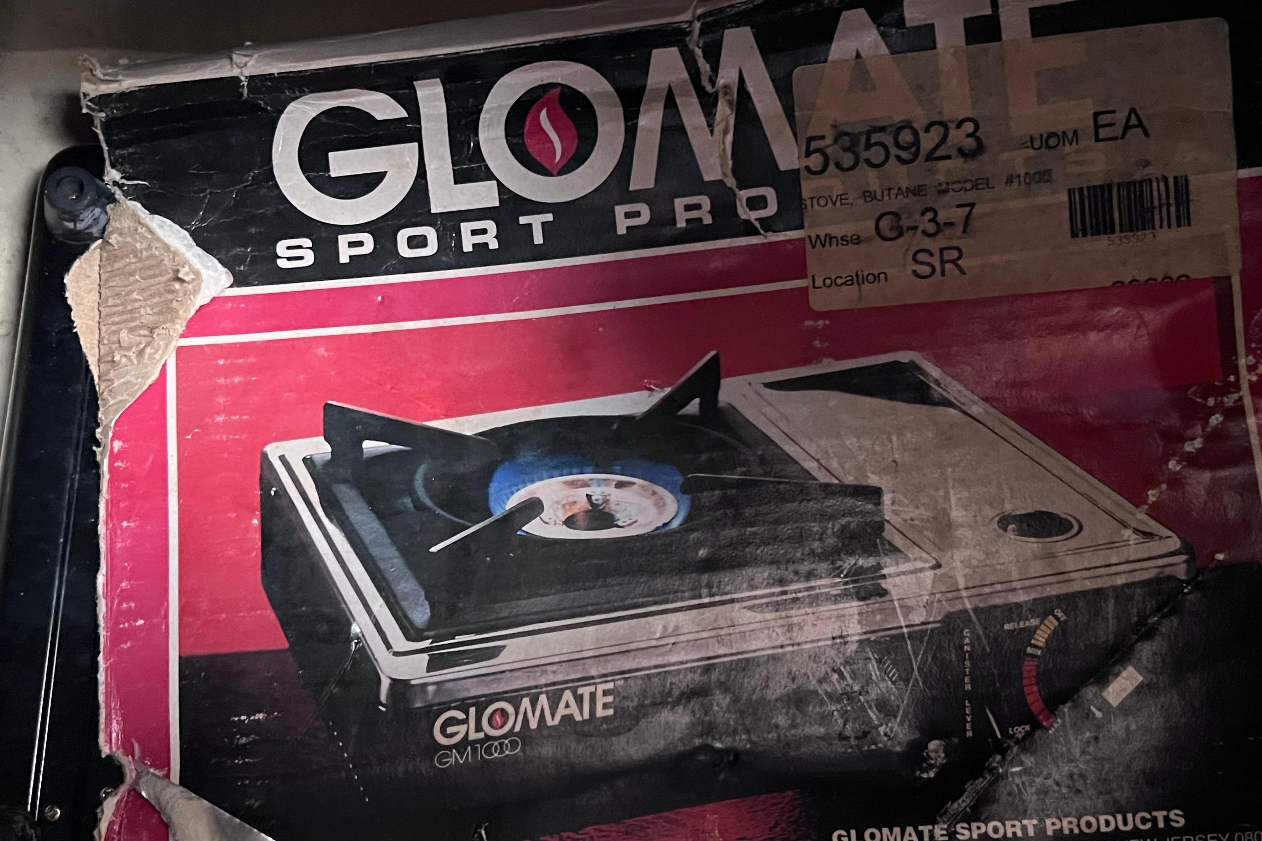 Box of GloMate Sport Pro GM1000 portable butane stove with worn packaging.