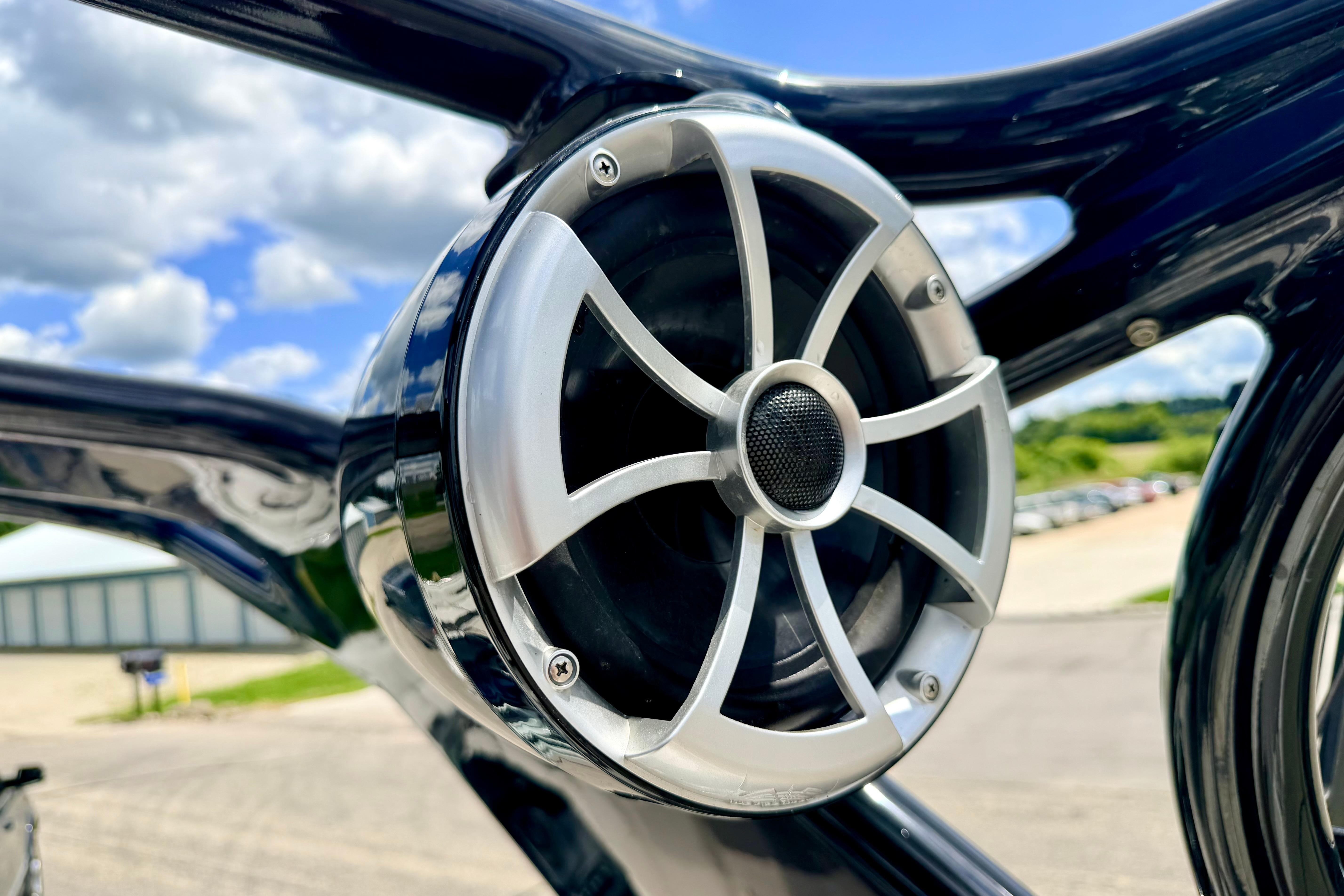 Close-up of a speaker on a 2015 Chaparral Sunesta 264 boat, with a clear sky background.