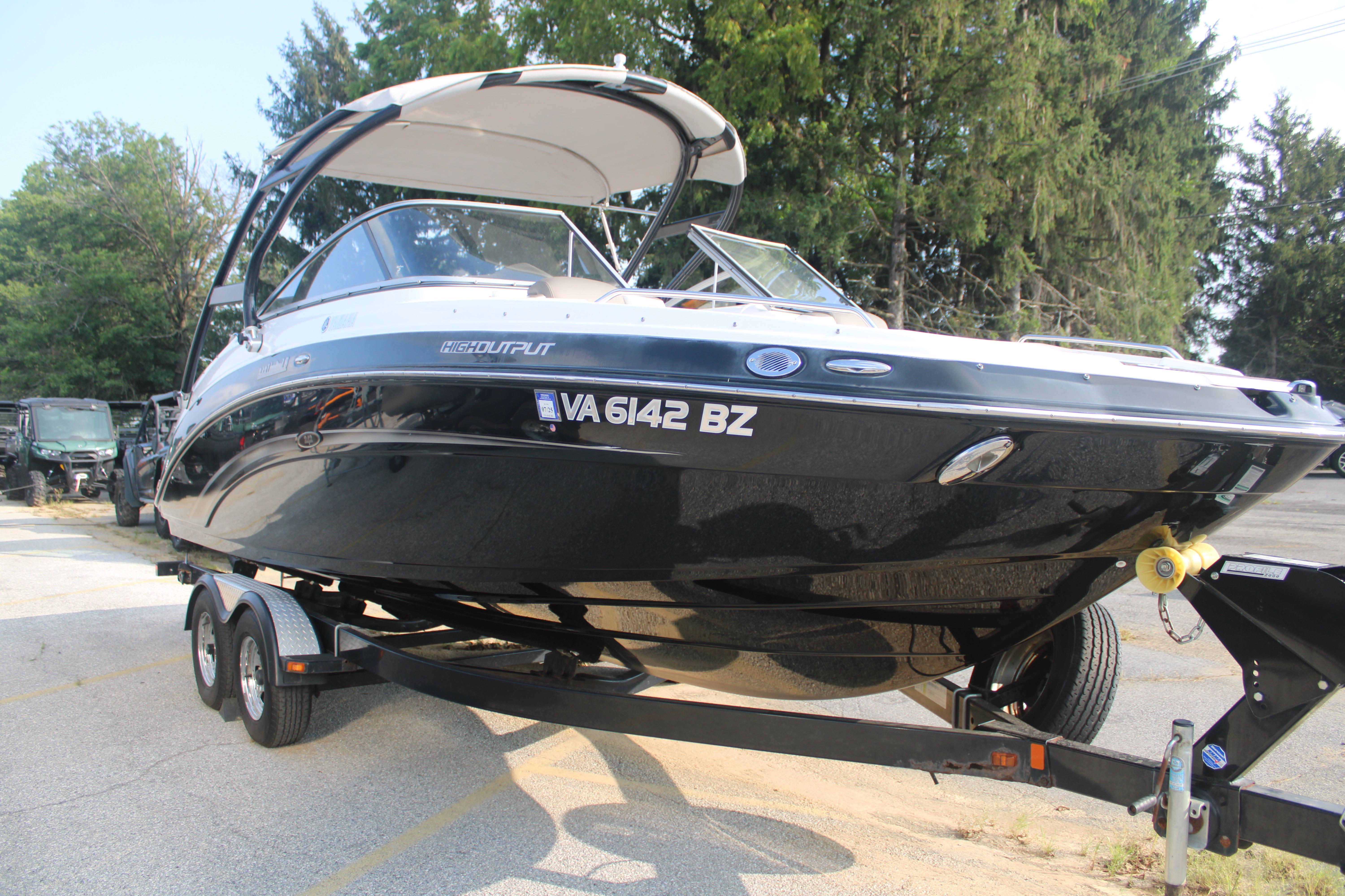 2013 Yamaha Boats 242 Limited S on trailer, parked outdoors.