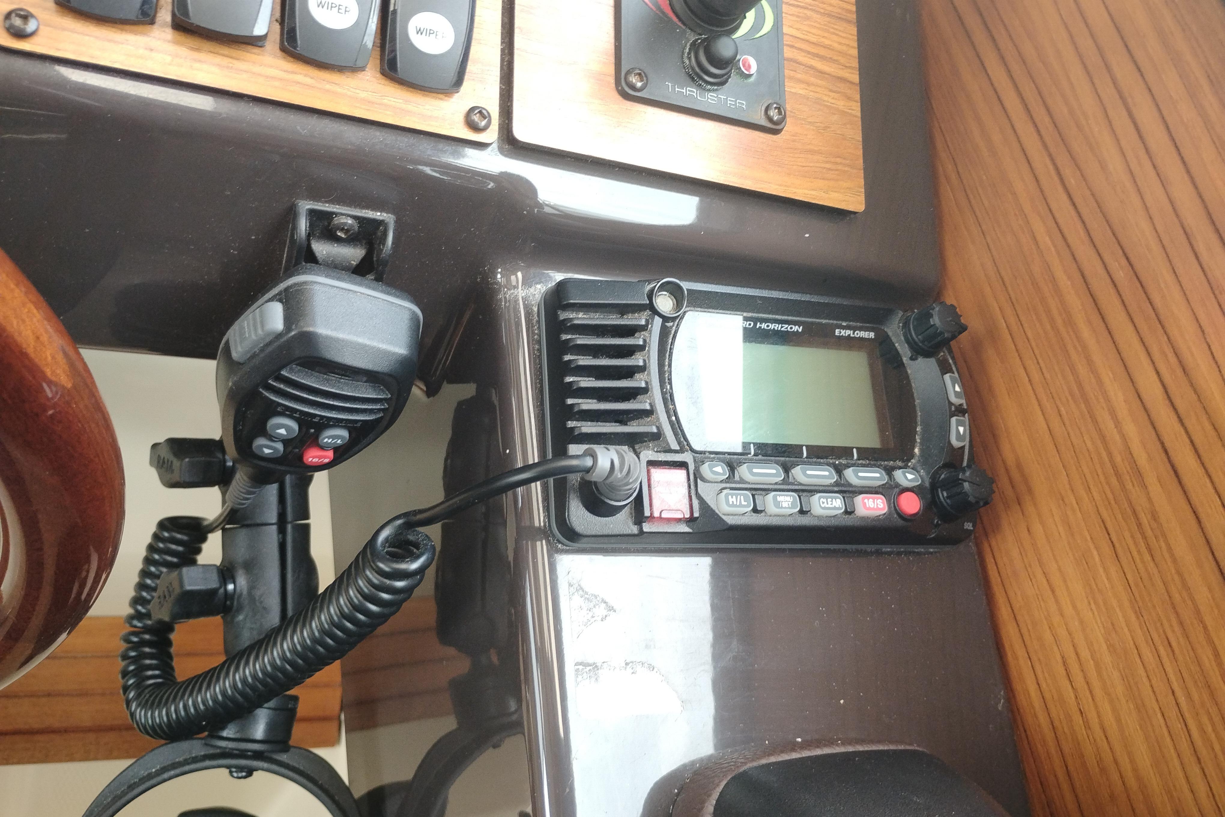 Control panel of a 2021 Ranger Tugs R-27 with radio and thruster controls.