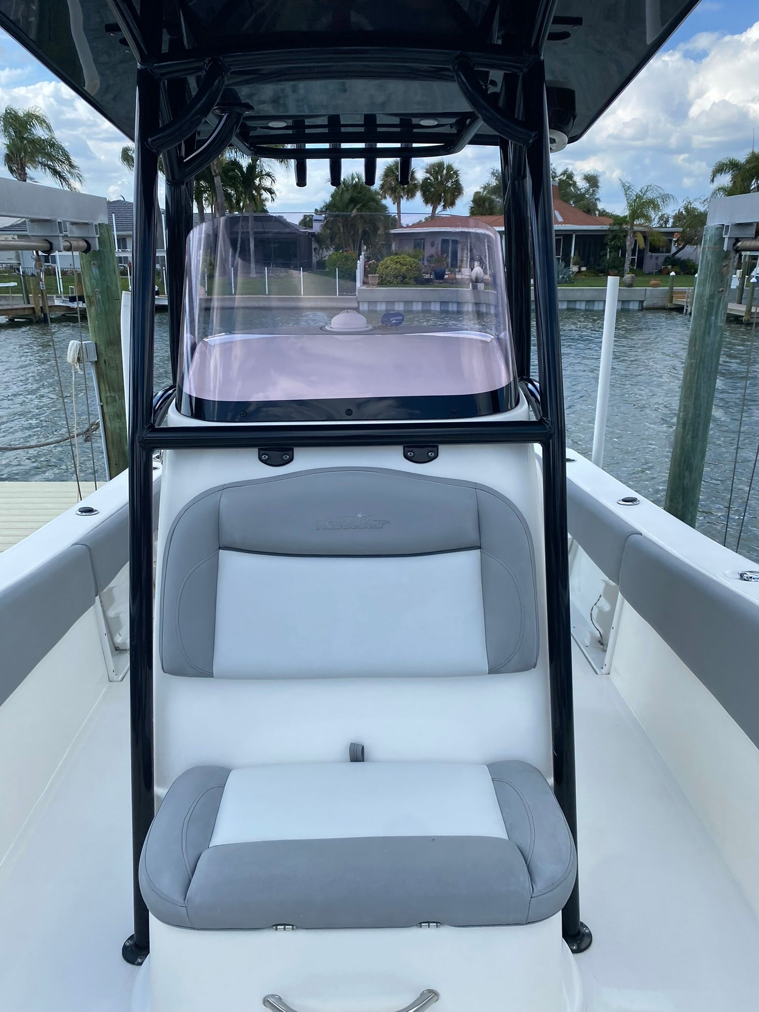 2021 NauticStar Legacy boat with gray seating at dock.