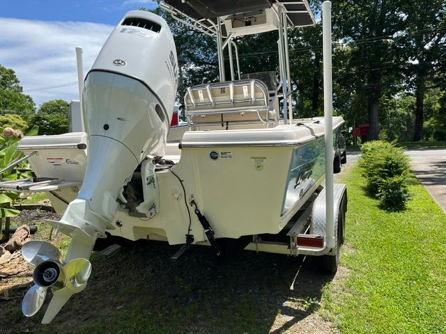 A 2022 Carolina Skiff 21 Ultra Elite boat on a trailer outdoors.