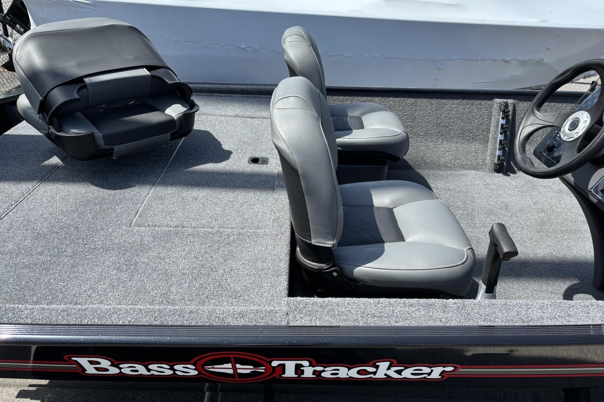 2026 Tracker Bass Tracker Classic XL boat interior with gray seating and steering wheel.