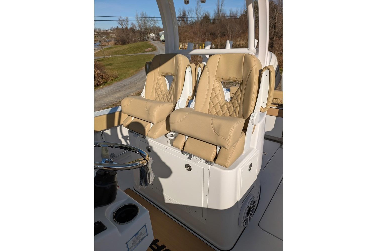 2025 Sportsman Open 282 Center Console with tan cushioned seats and steering wheel.