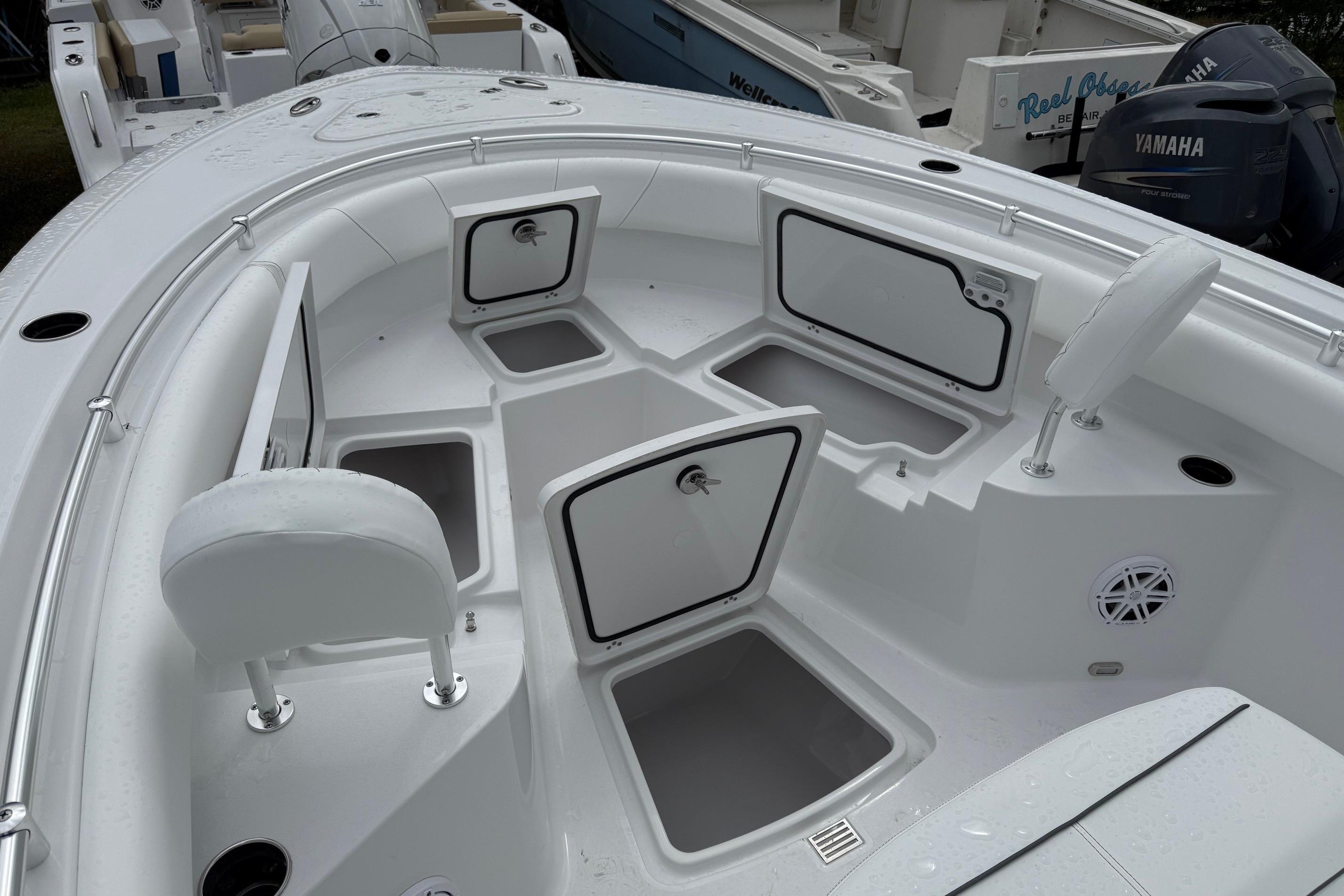 2026 Sportsman Heritage 231 Center Console boat with open storage compartments.