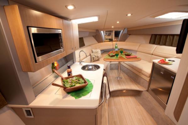 Manufacturer Provided Image: Interior of 2013 Formula 350 Sun Sport yacht with modern kitchen and cozy seating area.