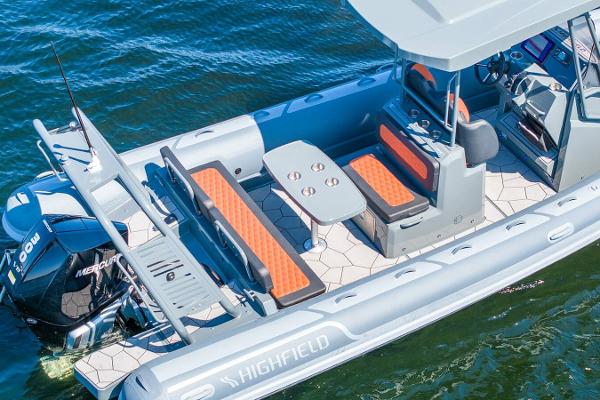 Manufacturer Provided Image: Highfield Sport 760 boat, 2025 model, with seating and table on water.
