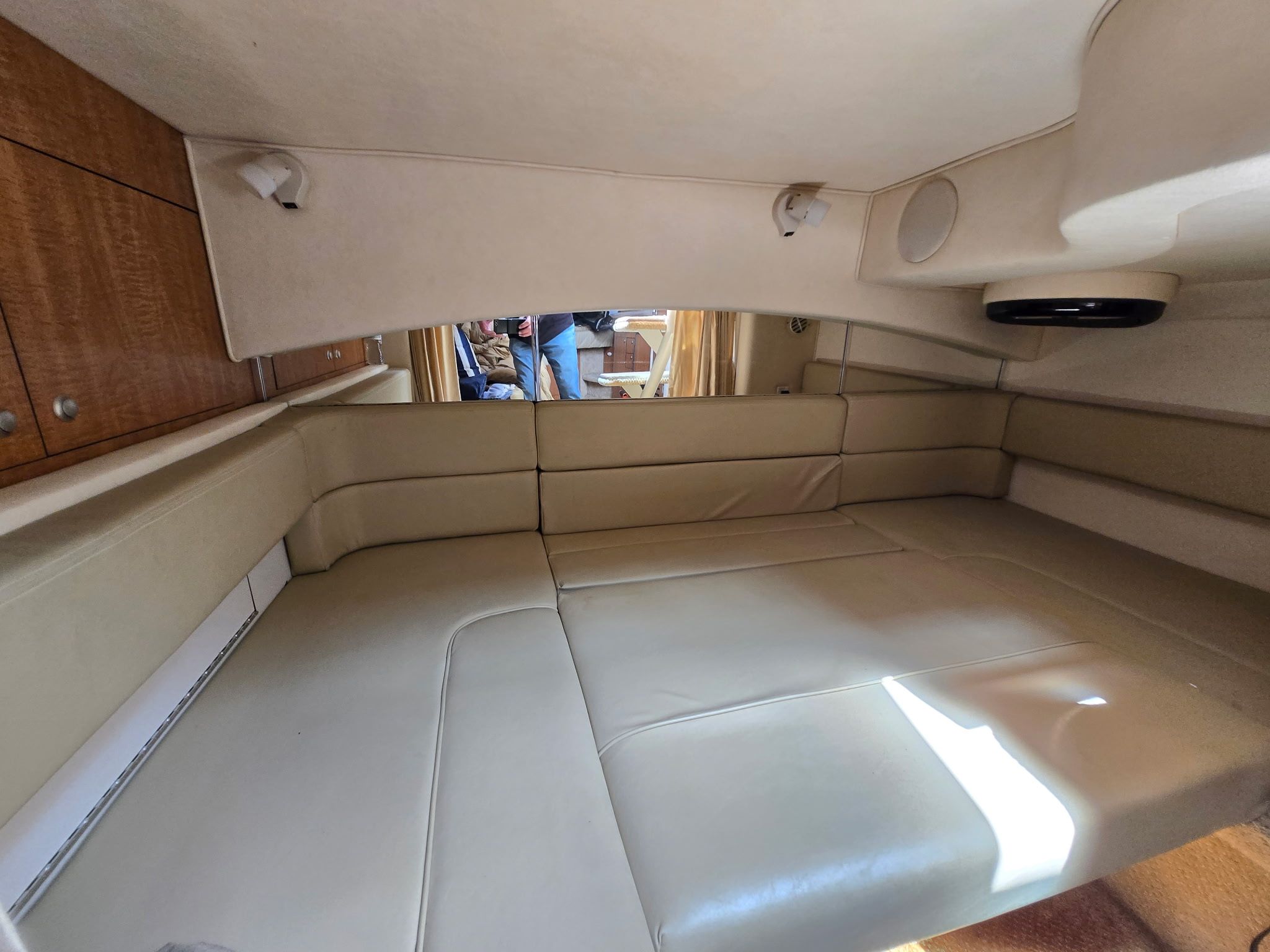 Interior of the 2006 Sea Ray 300 Sundancer with beige upholstery.
