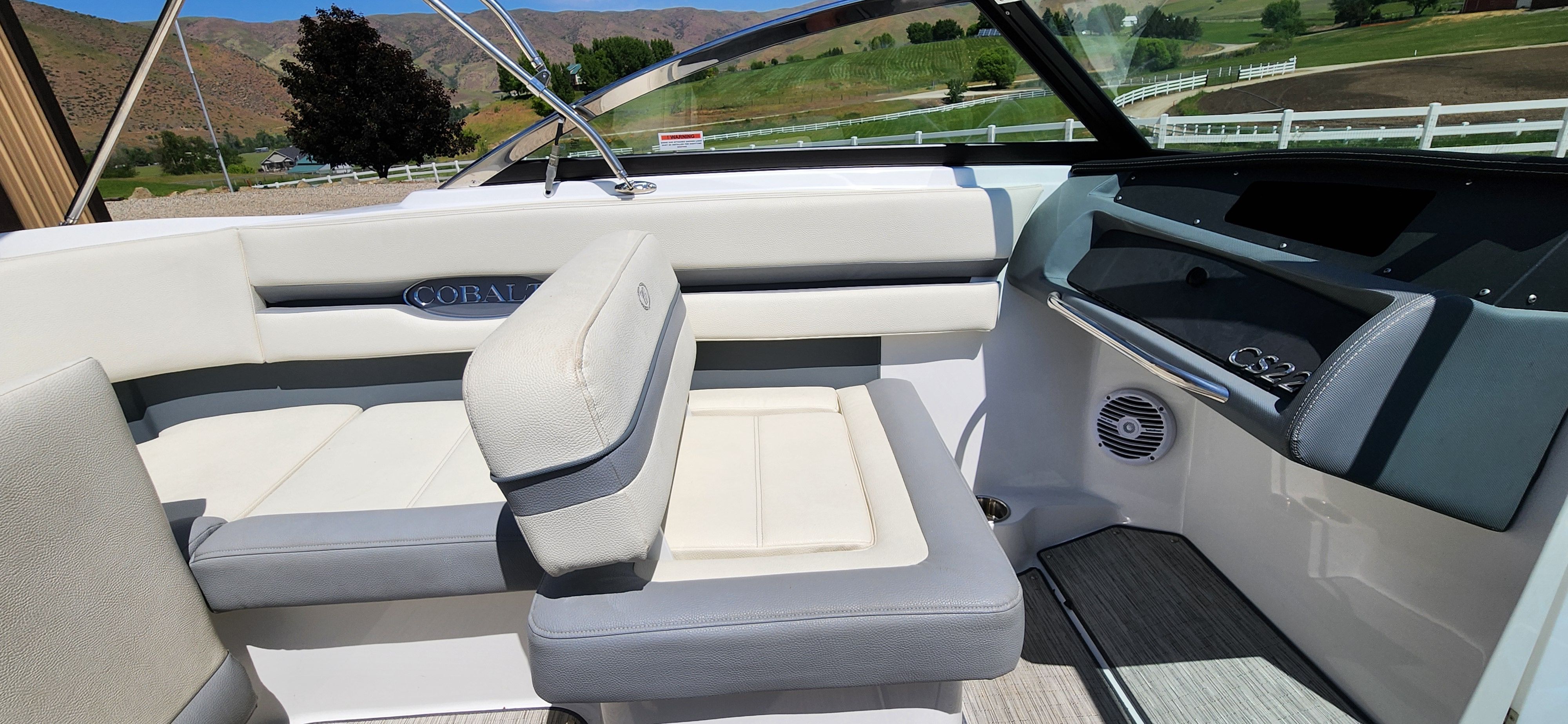 Interior of a Cobalt CS22 boat with white and gray seating.