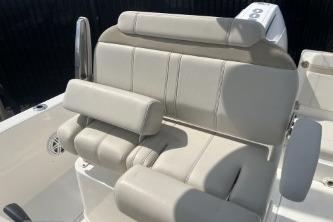 2024 Boston Whaler 220 Dauntless boat seating, featuring comfortable beige upholstery.
