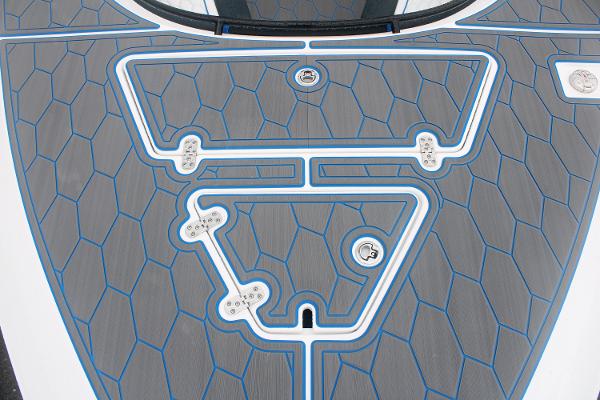 2024 Fountain 34 SC boat deck with geometric pattern and blue accents.