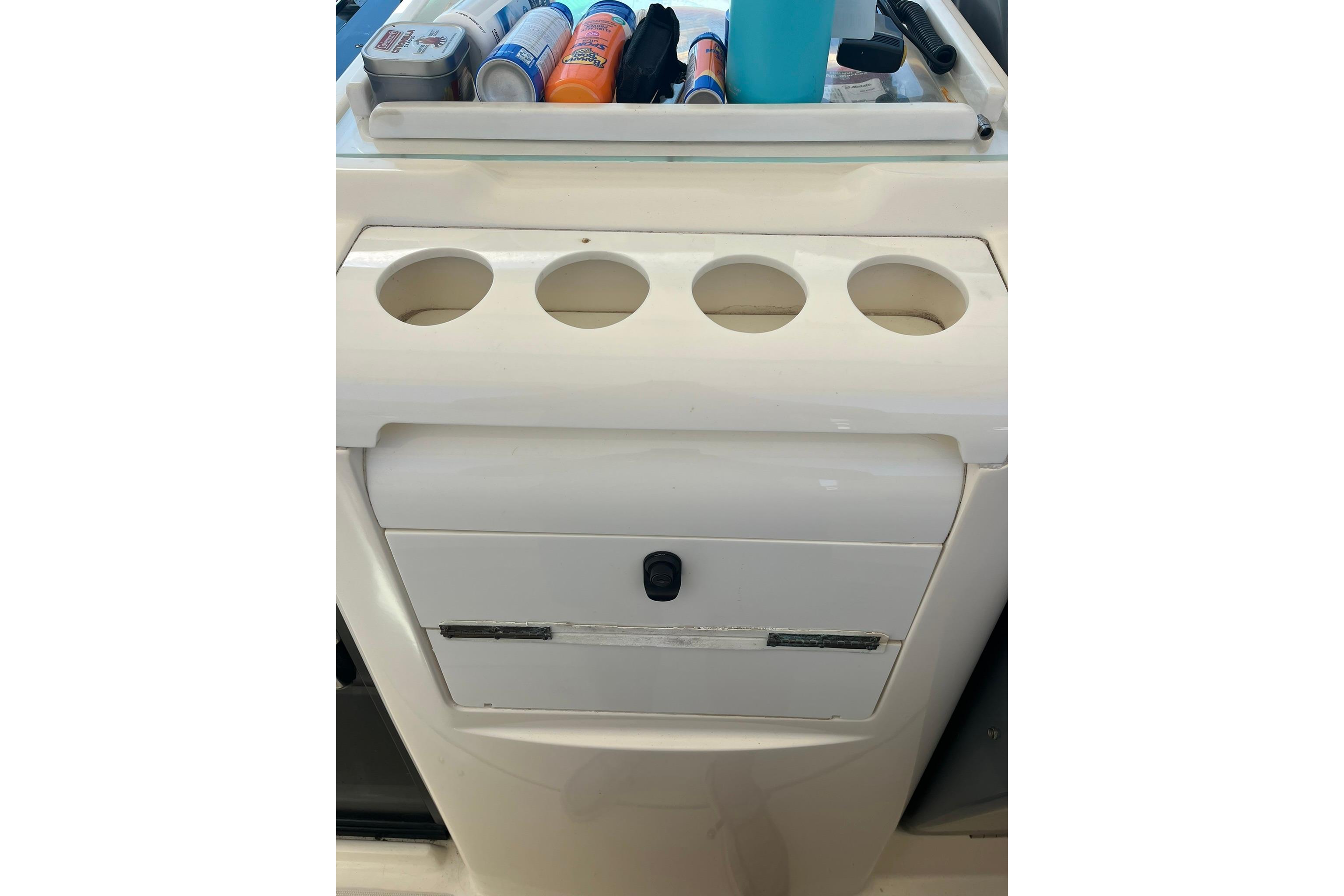 Cup holders and storage on a 1996 Tiara Yachts 3500 Express boat.