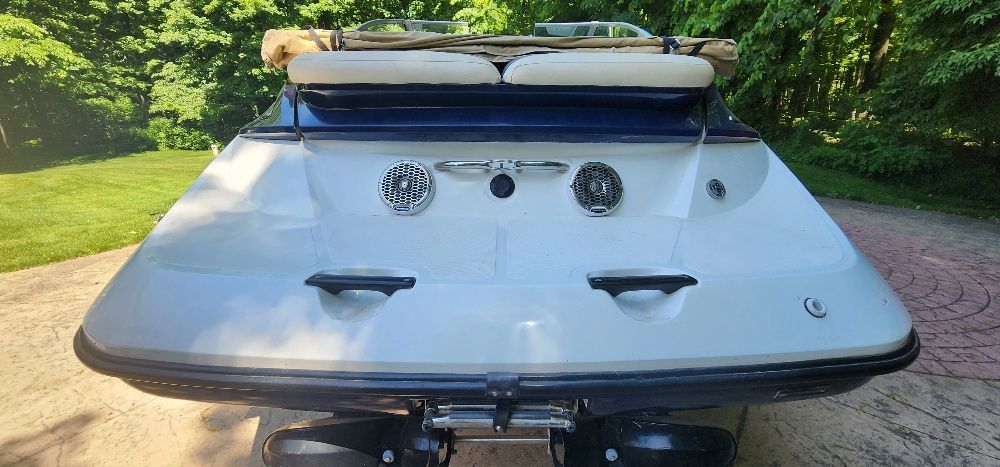 Rear view of a 2007 Sea-Doo Sport Boats 230 Challenger SE with cushioned seats and speakers.