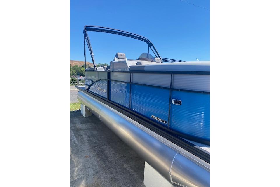 2026 Manitou 23 AURORA RF VPII 575 pontoon boat with blue exterior and sleek design.
