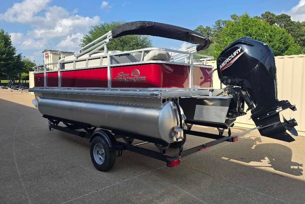 2026 Sun Tracker Bass Buggy 18 DLX pontoon boat with Mercury outboard motor.