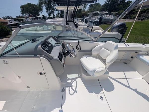 2025 Robalo R207 Dual Console boat interior with steering wheel and seating.