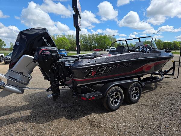 2025 Nitro ZV-20 SPORT boat with powerful outboard motor, parked outdoors under a blue sky.
