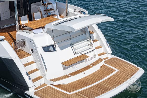 Sunseeker Manhattan 68 yacht, 2025 model, featuring elegant teak deck and modern design.