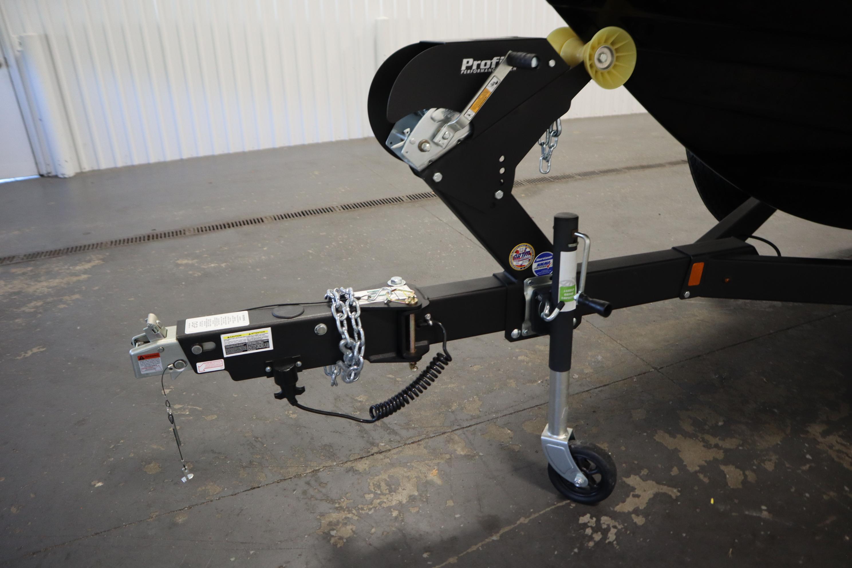 Trailer hitch of 2026 Yamaha Boats AR250, featuring secure chains and wheel jack.