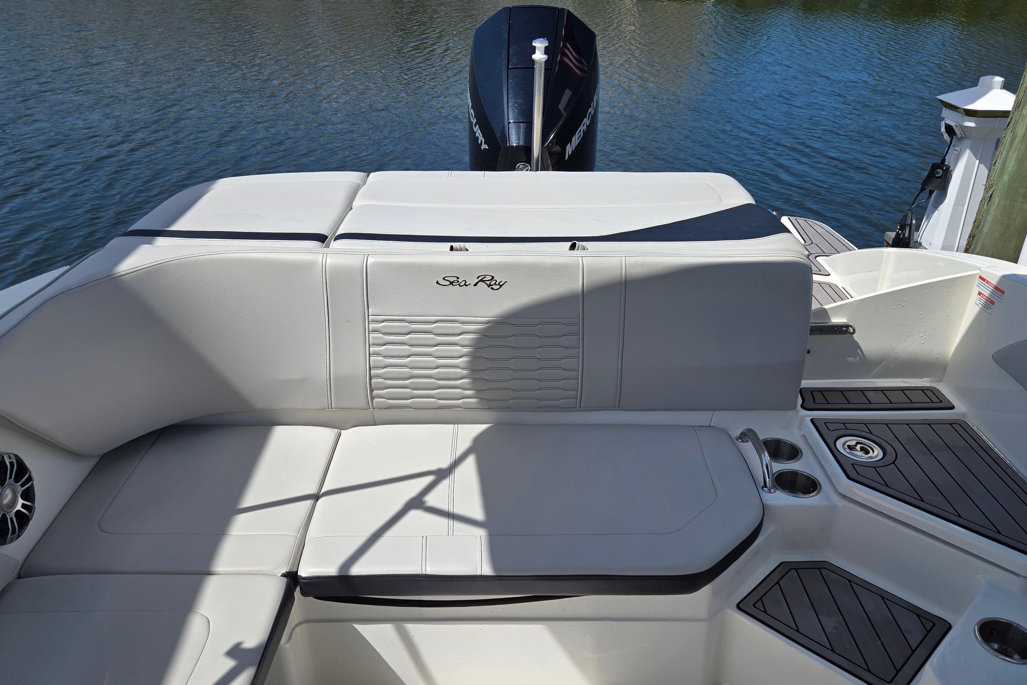 2023 Sea Ray SPX 210 boat interior with comfortable seating and sleek design.