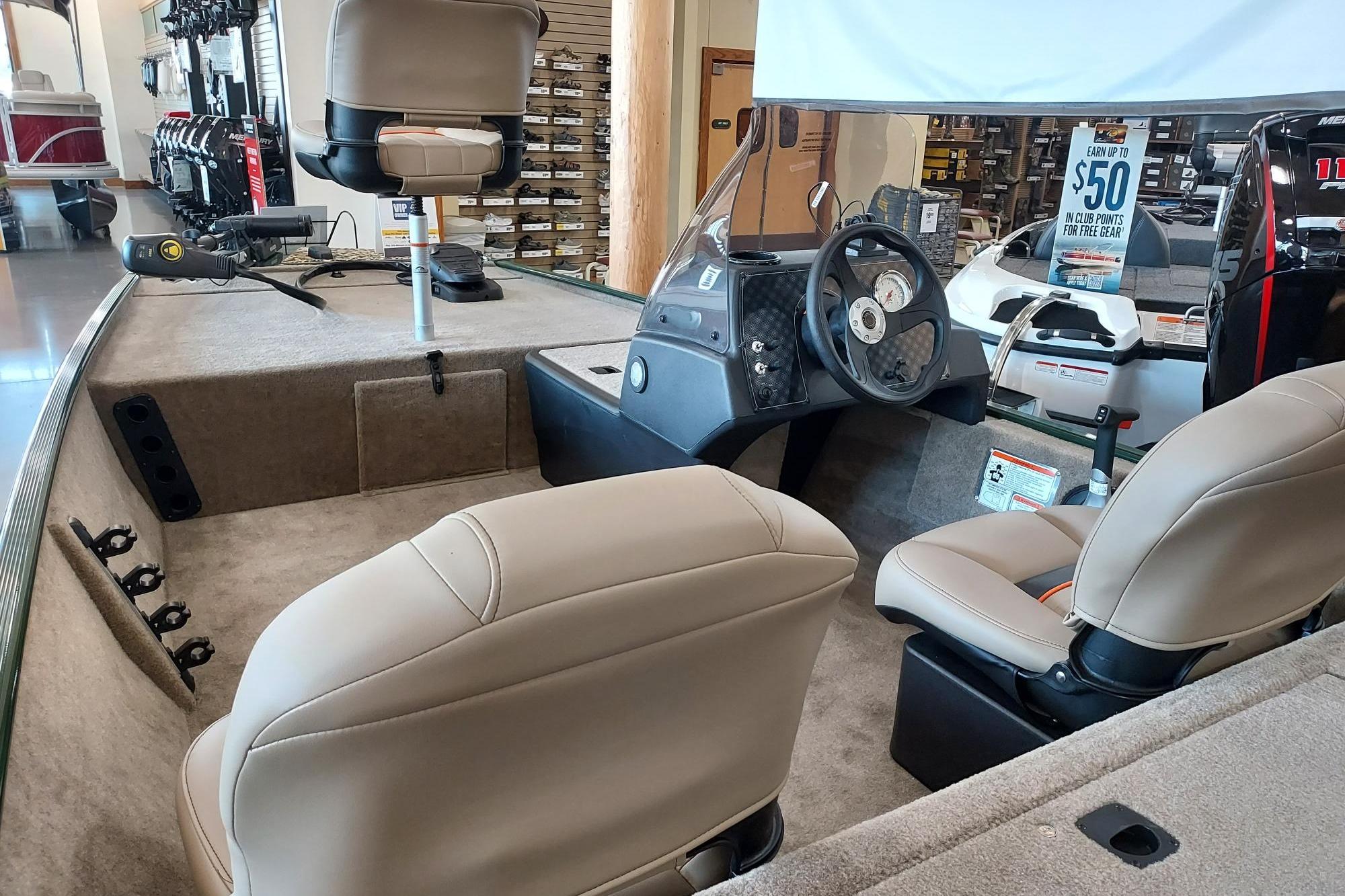 2026 Tracker Bass Tracker Classic XL interior with beige seats and steering console.