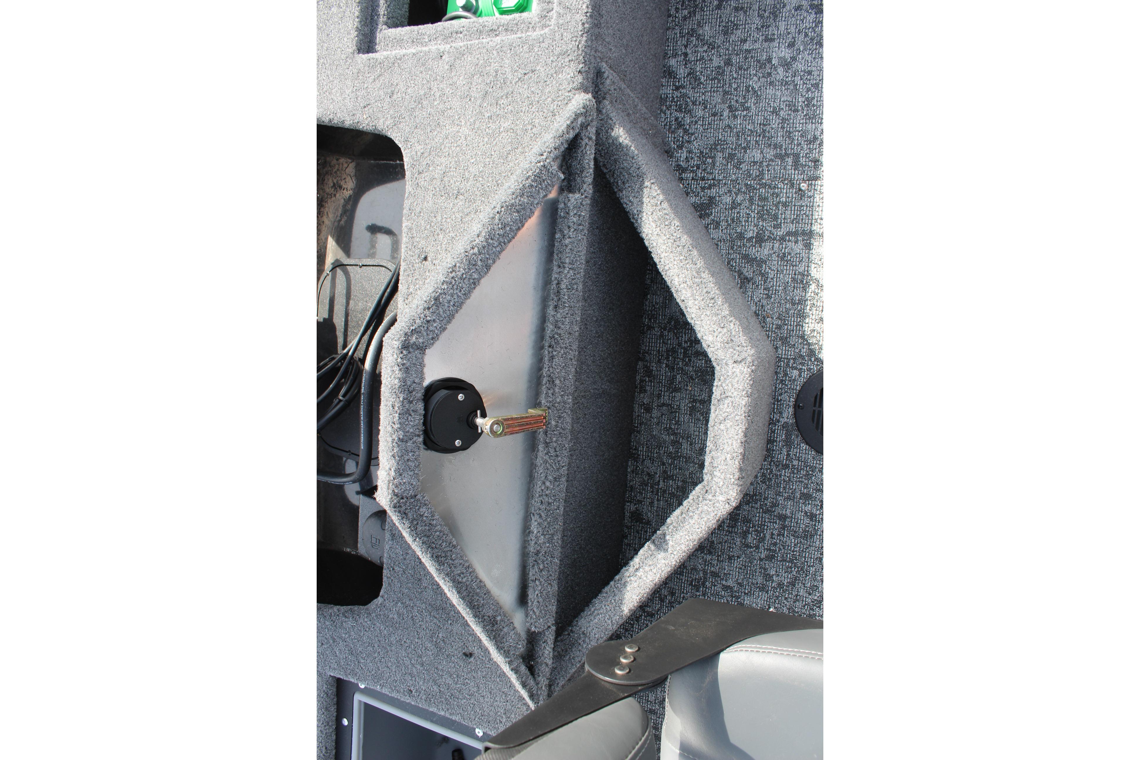 Interior view of 2026 Tracker Targa V-18 Combo boat, featuring storage compartment.
