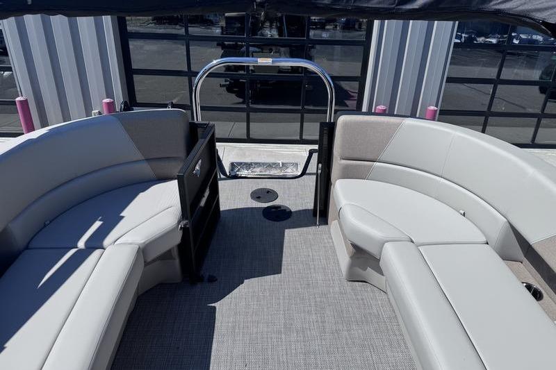 Interior view of 2027 Manitou Aurora 23 RF SHP pontoon boat with stylish seating.